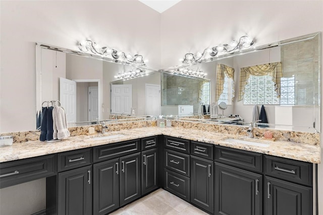 bathroom with tile patterned flooring and vanity