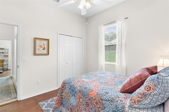 bedroom featuring hardwood / wood-style floors, ceiling fan, and a closet