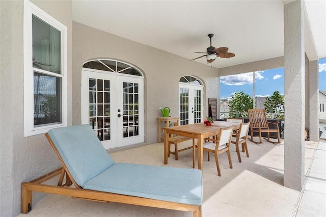 view of patio featuring ceiling fan and french doors