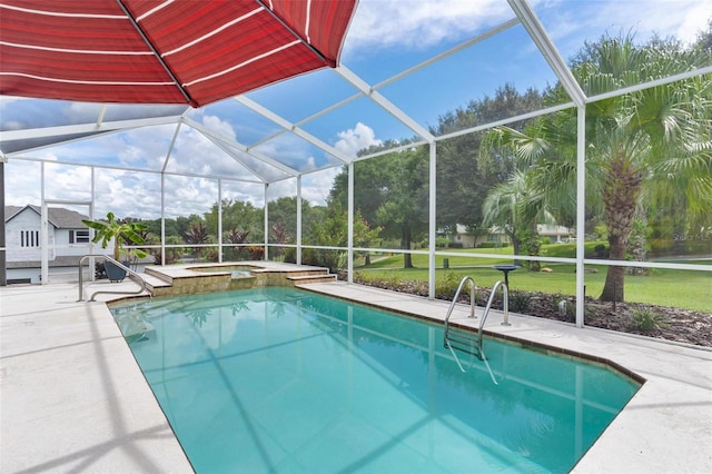 view of pool featuring glass enclosure, a patio area, and an in ground hot tub