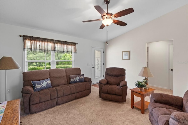 carpeted living room featuring ceiling fan and vaulted ceiling