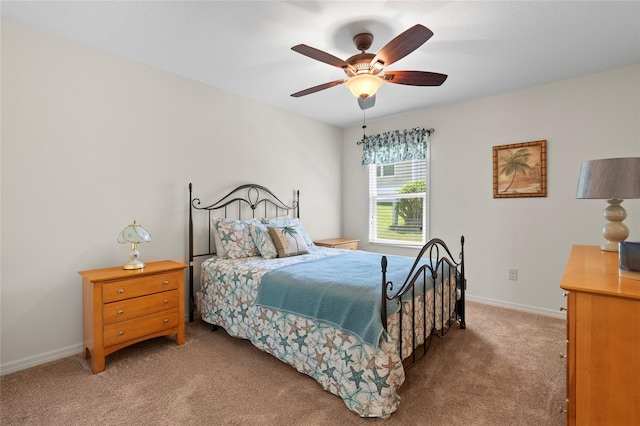 bedroom with carpet floors, ceiling fan, and baseboards