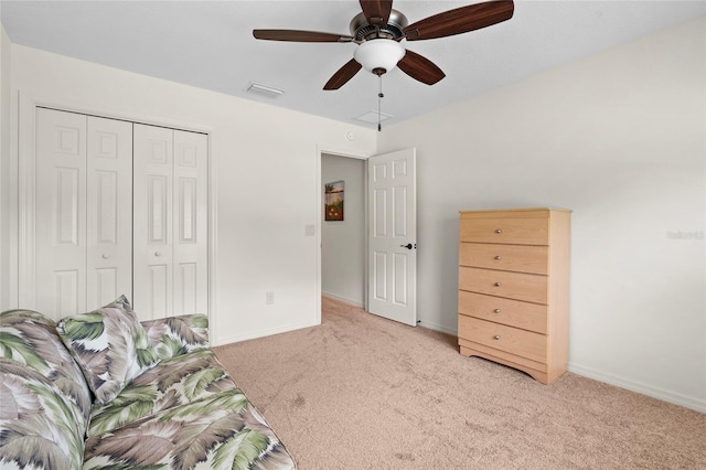 unfurnished room with light carpet, baseboards, visible vents, and a ceiling fan