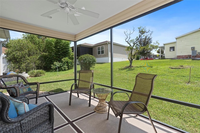 sunroom / solarium featuring ceiling fan