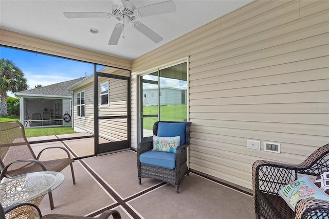 sunroom / solarium with ceiling fan and plenty of natural light