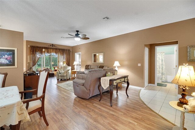 32915 Crooked Oaks Ln, Leesburg, FL 34748 - living area with ceiling fan, light wood-type flooring, visible vents, and baseboards