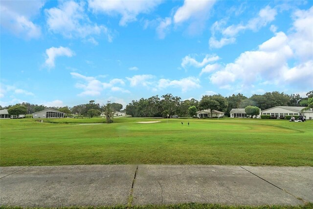 32915 Crooked Oaks Ln, Leesburg, FL 34748 - view of home's community with a lawn and golf course view