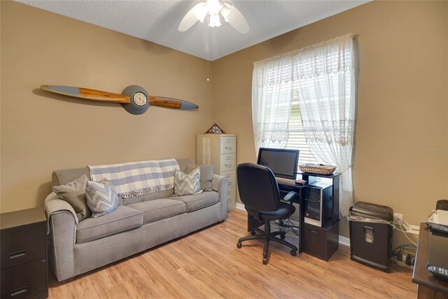 32915 Crooked Oaks Ln, Leesburg, FL 34748 - home office with a ceiling fan, light wood-type flooring, and baseboards