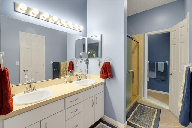 32915 Crooked Oaks Ln, Leesburg, FL 34748 - full bath with double vanity, a stall shower, tile patterned flooring, and a sink