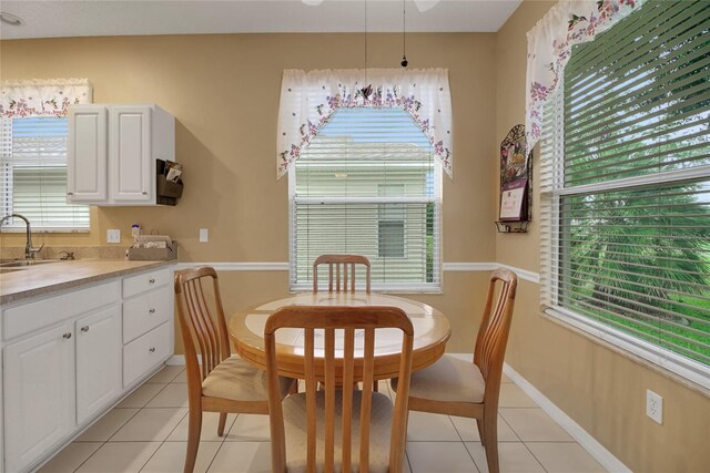 32915 Crooked Oaks Ln, Leesburg, FL 34748 - dining room featuring baseboards and light tile patterned flooring