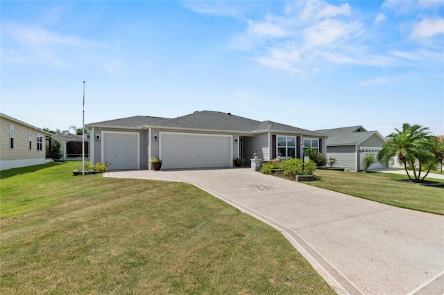 ranch-style house with a front yard, concrete driveway, and an attached garage