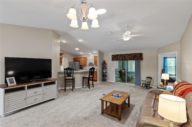 living room with lofted ceiling, baseboards, a ceiling fan, and light colored carpet