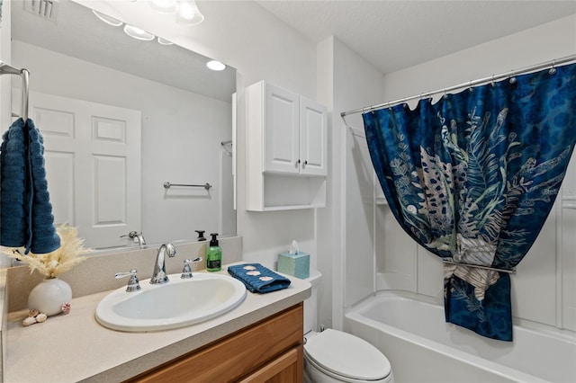 bathroom with a textured ceiling, toilet, vanity, visible vents, and shower / bathtub combination with curtain