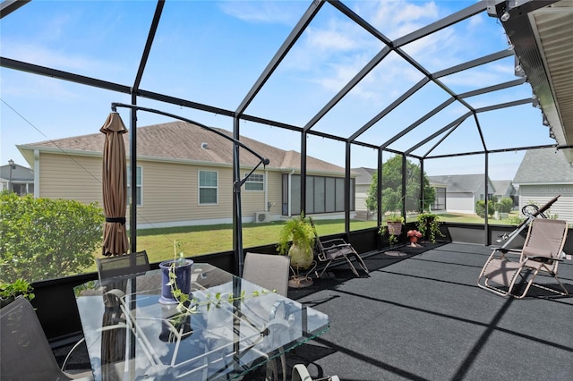 view of patio / terrace with a residential view, a lanai, and outdoor dining space