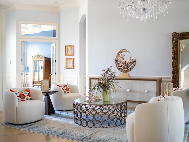 living room with radiator, a wealth of natural light, an inviting chandelier, and ornamental molding