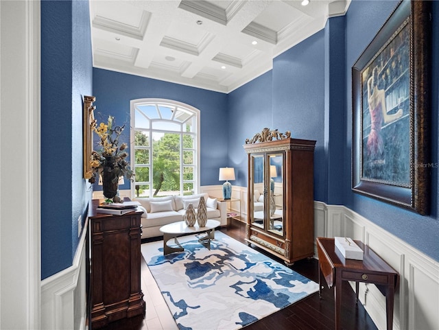 sitting room featuring beam ceiling, dark wood-type flooring, crown molding, and coffered ceiling