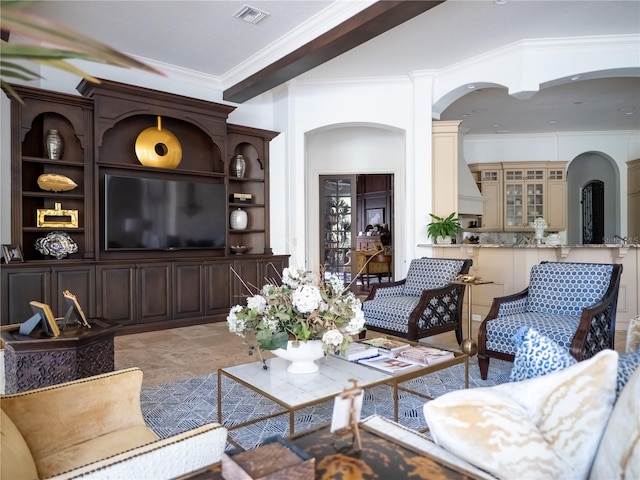 living room featuring crown molding