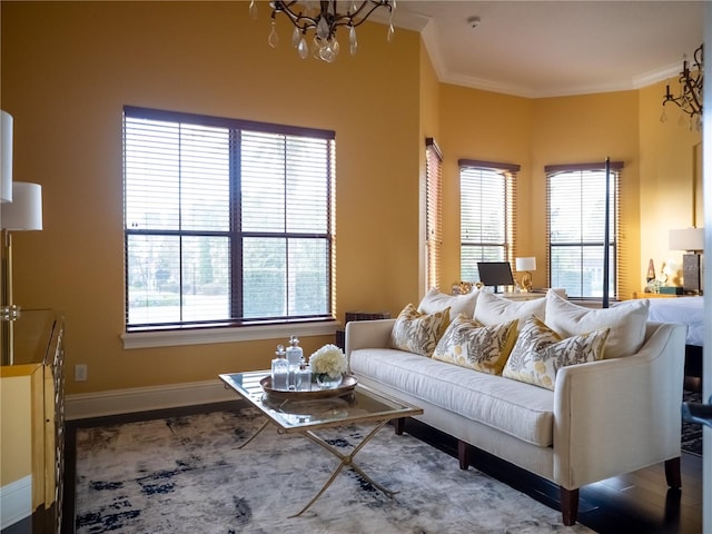 living room with hardwood / wood-style flooring, crown molding, and a wealth of natural light