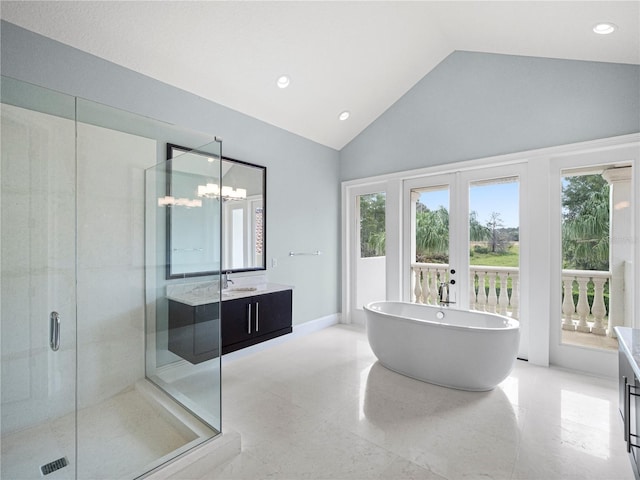 bathroom featuring french doors, an inviting chandelier, high vaulted ceiling, separate shower and tub, and vanity