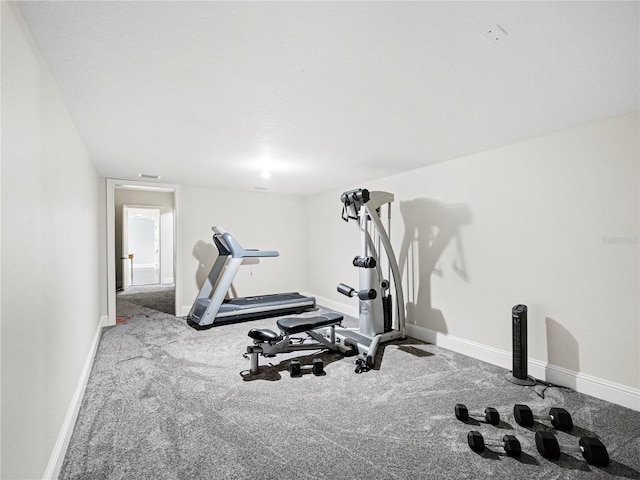 exercise room with carpet flooring