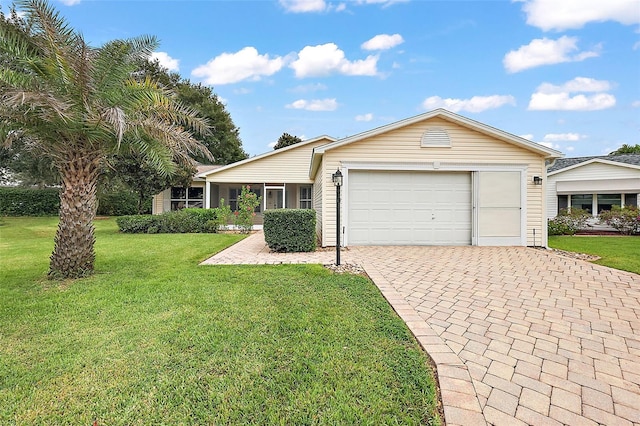 ranch-style home featuring a garage and a front yard