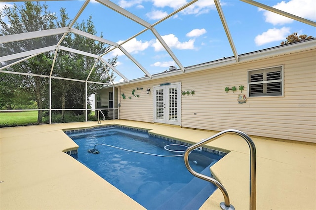 view of pool featuring a patio area and glass enclosure