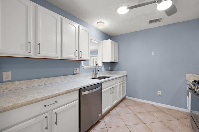 kitchen with white cabinetry, stainless steel appliances, sink, and ceiling fan