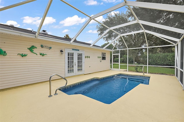 view of swimming pool featuring a lanai and a patio area