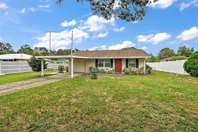 ranch-style home featuring a carport and a front yard