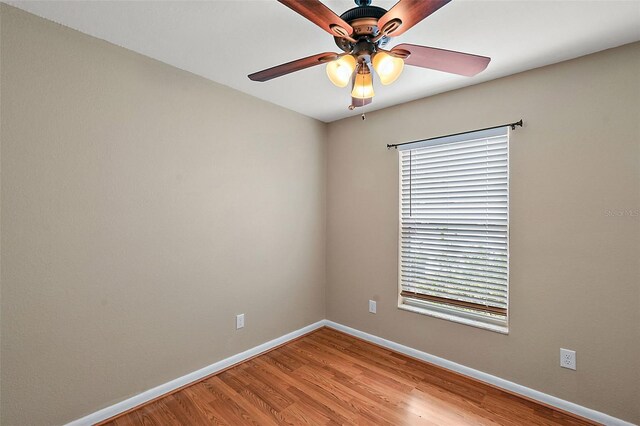 empty room featuring ceiling fan and light hardwood / wood-style flooring