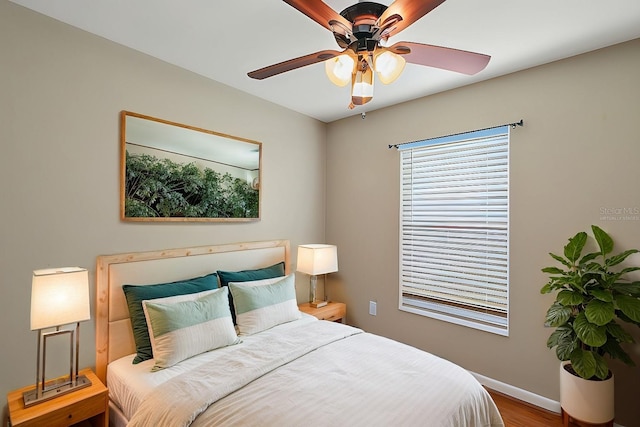 bedroom featuring ceiling fan and wood-type flooring