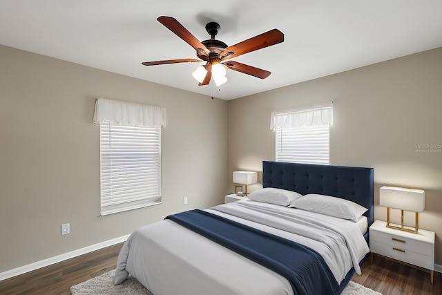 bedroom featuring ceiling fan and dark hardwood / wood-style flooring