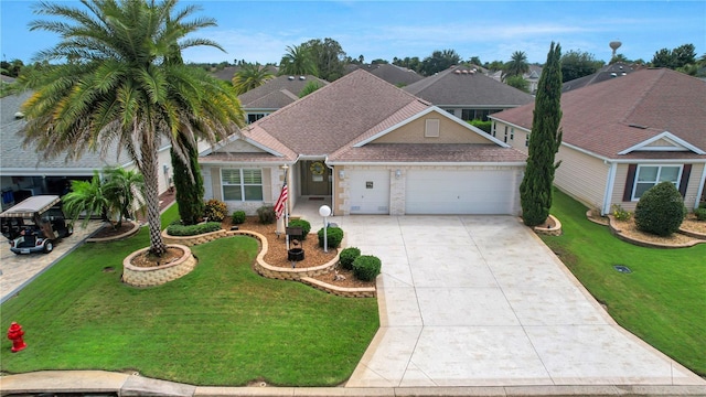 view of front of house featuring a front yard and a garage