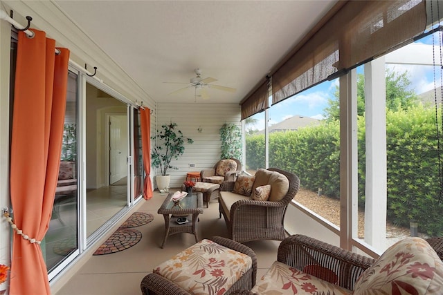 sunroom featuring ceiling fan