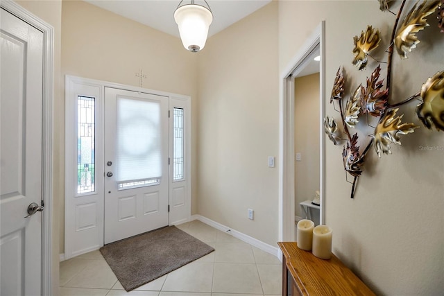 foyer entrance with light tile patterned floors