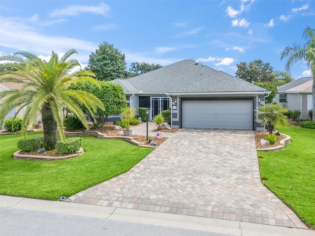 ranch-style home with a garage and a front lawn