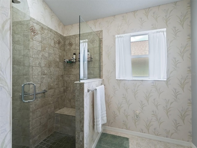 bathroom featuring a textured ceiling and walk in shower