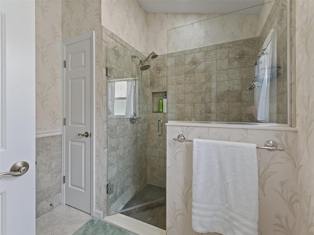 bathroom featuring an enclosed shower and tile patterned flooring