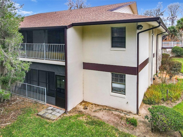 back of house with a balcony