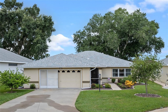 single story home with a front lawn and a garage