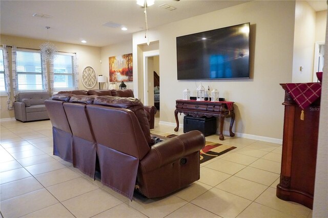 living room featuring recessed lighting, baseboards, visible vents, and light tile patterned flooring