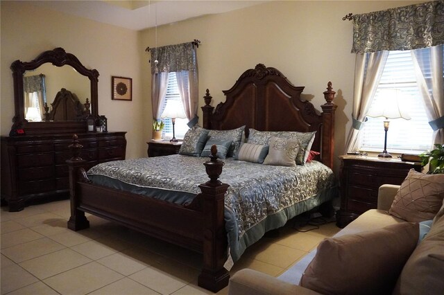 bedroom with light tile patterned flooring