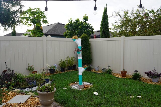 view of yard with a fenced backyard