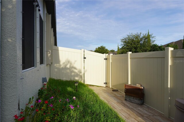 view of yard featuring a gate and fence