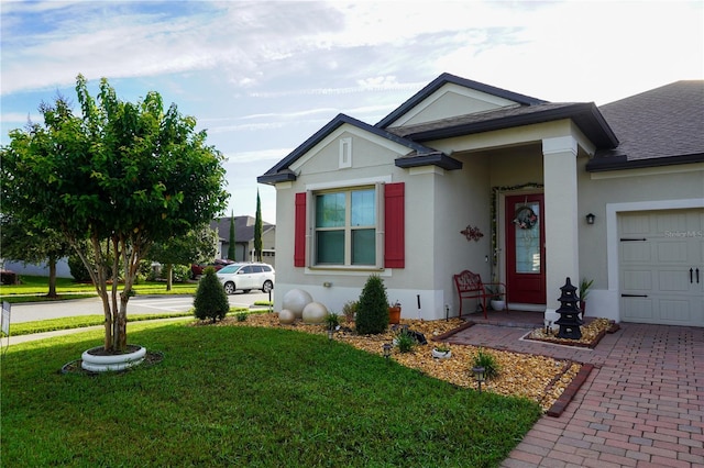 view of front facade featuring a front lawn and a garage