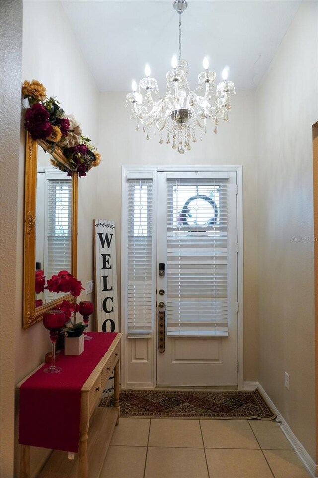 entrance foyer featuring tile patterned flooring and baseboards