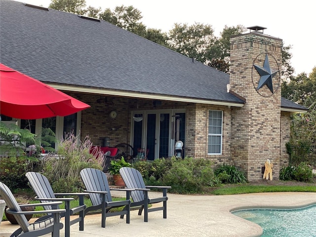 rear view of house featuring a patio