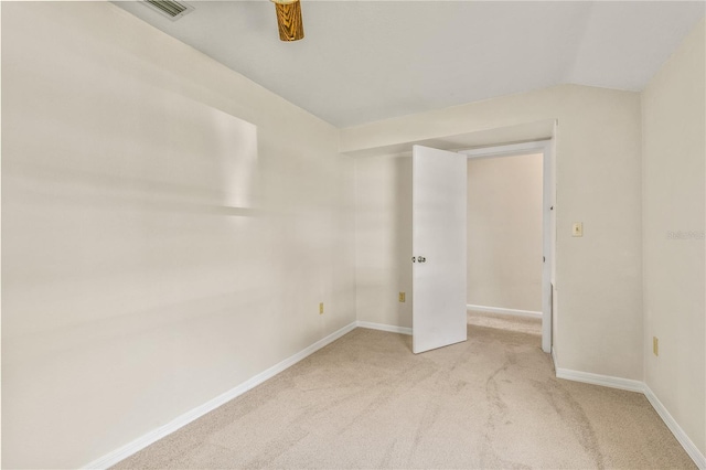 19402 E 5th St, Umatilla, FL 32784 - unfurnished room featuring light carpet, baseboards, and lofted ceiling