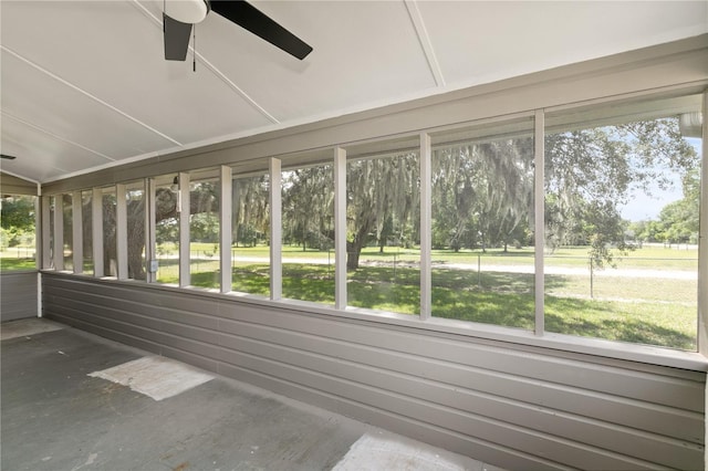 19402 E 5th St, Umatilla, FL 32784 - unfurnished sunroom with ceiling fan and view of scattered trees