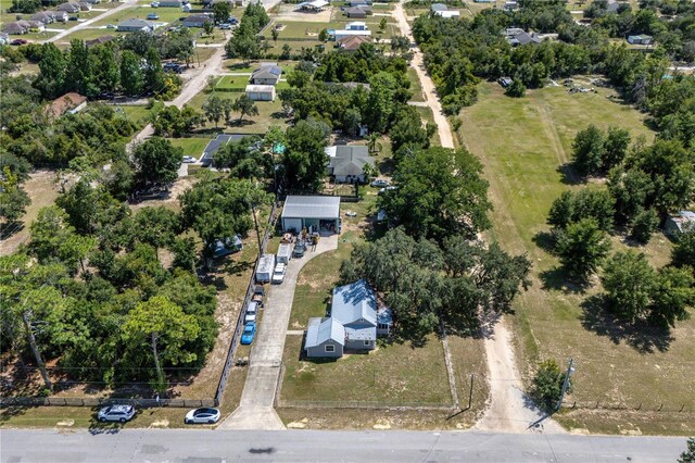 19402 E 5th St, Umatilla, FL 32784 - aerial overview of property's location with a tree filled landscape